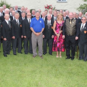 A charity concert in aid of the Robert Johns Leukaemia Fund was held at Week St Mary church on Saturday 4th July with Mousehole Male Voice Choir.The choir are pictured with main trustee Bob Johns MBE and flutist Maureen Nichols.Bob wishes to say a 